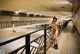 A naked woman standing in a subway station.