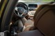 A woman sitting in the driver's seat of a car.