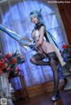 A woman in lingerie holding a sword in front of flowers.