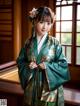 A woman in a green and gold hanbok standing in front of a window.