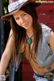 A woman in a cowboy hat posing for a picture.