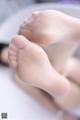 A close up of a person's feet in a bathtub.